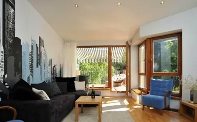 a living room with a couch and a table at Prague City Loft And Studio in Prague
