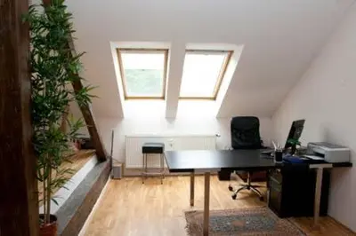 a room with a piano in a room with a window at Prague City Loft And Studio in Prague