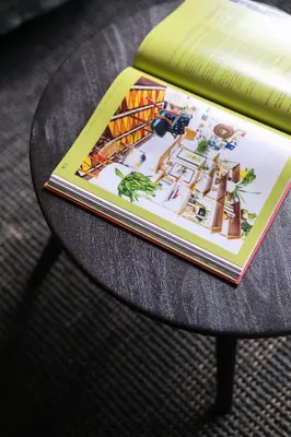 a book sitting on top of a table at Bohemian Mystery by Prague Castle in Prague