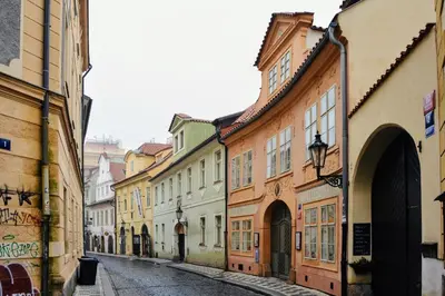 an empty street in an old town with buildings at Apartmán Míšeňská in Prague