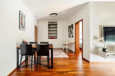 a living room with a table and a couch at Luxury Apartment in the Heart of Prague in Prague