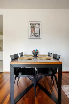 a bedroom with a bed with a picture on the wall at Luxury Apartment in the Heart of Prague in Prague