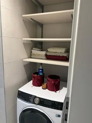 a laundry room with a washer and dryer at The Shalom in Prague