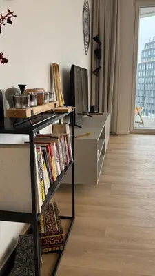 a room with a desk and a book shelf with books at The Shalom in Prague