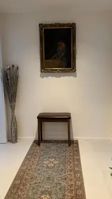 a picture of a painting on a wall with a table at The Shalom in Prague