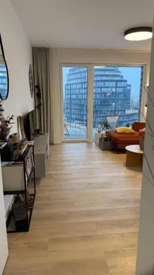 a living room with a view of a building at The Shalom in Prague