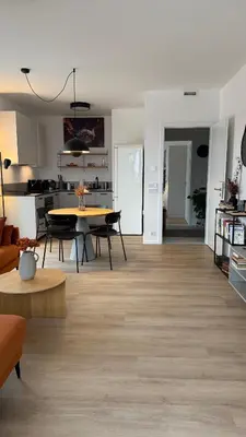a living room with a table and a dining room at The Shalom in Prague