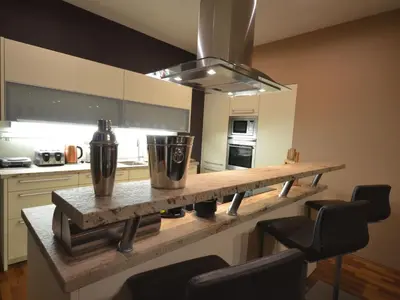 a kitchen with a counter with a stove top oven at Apartment mit Terrasse by Interhome in Prague