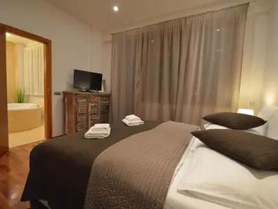 a bedroom with a bed with two towels on it at Apartment mit Terrasse by Interhome in Prague