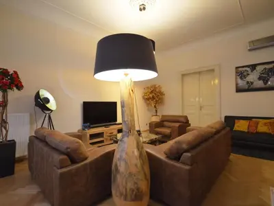 a living room with two couches and a lamp at Apartment Wohnung mit eigenem Balkon by Interhome in Prague
