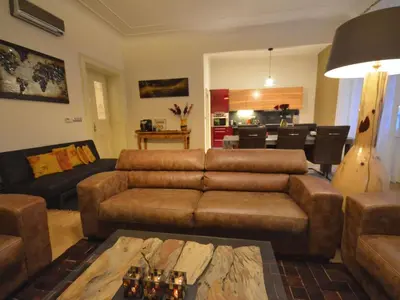 a living room with a couch and a table at Apartment Wohnung mit eigenem Balkon by Interhome in Prague