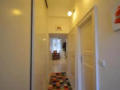 a hallway with a door leading to a dining room at Apartment Collection Hastalska by Interhome in Prague