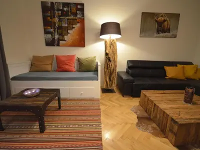 a living room with a couch and a coffee table at Apartment Collection Hastalska by Interhome in Prague