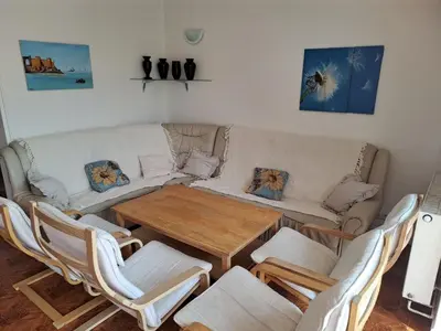 a living room with a table and a couch at Holiday Home Komfortvilla in Prag- Hallenbad- Whirlpool- Sauna by Interhome in Vranov