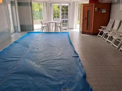a pool of water on the floor of a room at Holiday Home Komfortvilla in Prag- Hallenbad- Whirlpool- Sauna by Interhome in Vranov