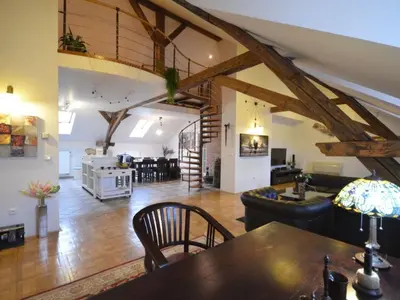 a living room with a wooden table and a living room at Apartment Apartment mit Waschmaschine und Geschirrspüler by Interhome in Prague