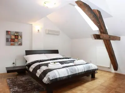 a bedroom with a bed in a attic at Apartment Apartment mit Waschmaschine und Geschirrspüler by Interhome in Prague