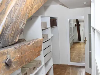 a hallway with white drawers and a stairway at Apartment Apartment mit Waschmaschine und Geschirrspüler by Interhome in Prague