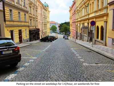 an empty street with cars parked on the street on waggleys for or at Apartment Paradies-Wohnung by Interhome in Prague