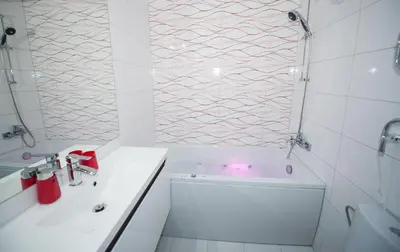 a bathroom with a tub and a sink and a shower at Honeymoon Ruterra studio in Prague