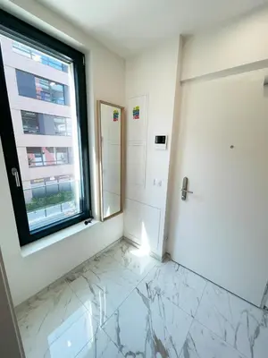 a bathroom with a window and a marble floor at Modern Žižkov apartment in the center in Prague