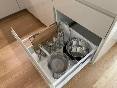 a drawer with many pots and pans in a kitchen at Modern Žižkov apartment in the center in Prague
