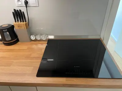 a laptop sitting on top of a wooden table at Modern Žižkov apartment in the center in Prague