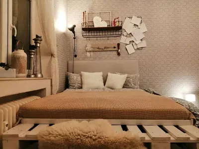 a bedroom with a bed with a bench in it at ANDĚL apartment VLTAVA' SPIRIT - Smíchov in Prague
