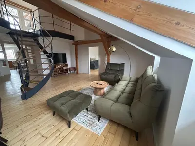 a living room with a couch and a table at Náměstí Míru 13 in Prague