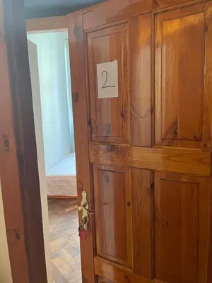 a room with a desk and a chair and a window at Central cozy rooms Soukenická S32 in Prague