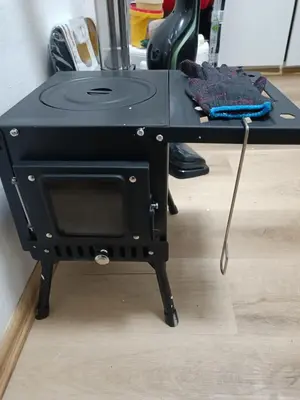 a table with a table cloth with a sewing machine on it at PRAHA nejlevnější in Loděnice