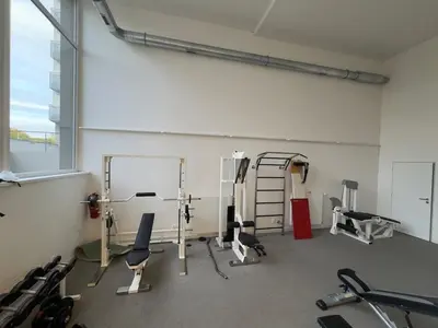 a room with a gym with chairs and a ladder at Smart Studio for Work & City Exploring in Prague