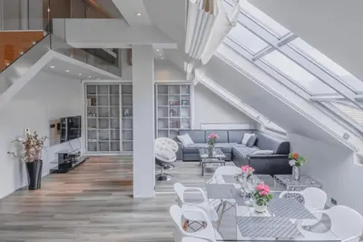 a living room with couches and tables at Luxury Apartment in Centre in Prague