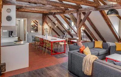 a living room with a couch and a table at Three Bedroom Apartment with terrace Kepler-4 Art in Prague