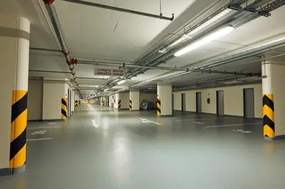 an empty parking garage with a long long hallway at Fortuna Garden II in Prague