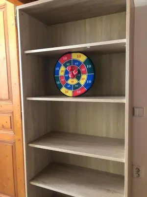 a shelf with a clock on top of it at Central cozy rooms Soukenická S33 in Prague