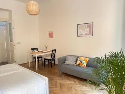 a living room with a couch and a table at Prague apartment 3 minutes from historical town in Prague