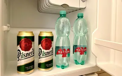 three bottles of mineral water in a refrigerator at Prague apartment 3 minutes from historical town in Prague