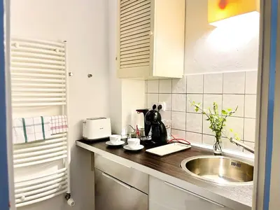 a kitchen with a sink and a counter top at Prague apartment 3 minutes from historical town in Prague