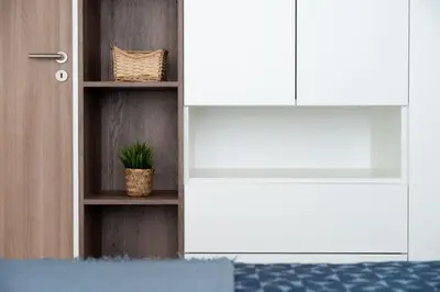 a white door with a plant in a room at Apartment near PVA Expo Prague & Concerts in Prague
