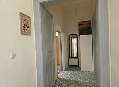 a hallway with a door leading into a room at Anhouse in Prague