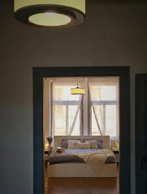 a bedroom with a bed in front of a window at Anhouse in Prague