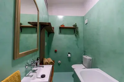 a bathroom with a sink and a toilet and a mirror at 2 bedroom apartment in New Town close to river in Prague