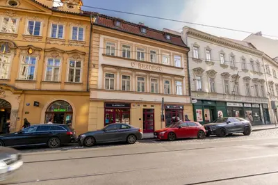 a row of cars parked in front of buildings at 2 bedroom apartment in New Town close to river in Prague