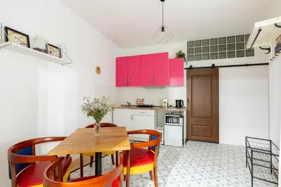 a kitchen and dining room with a wooden table and chairs at Apartment in Prague 1 next to Wenceslas Square in Prague