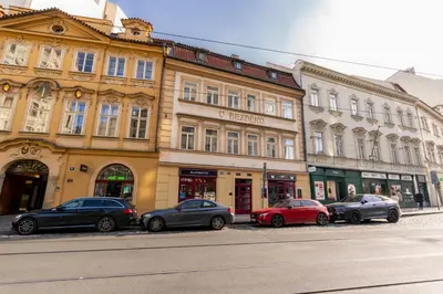 a group of cars parked in front of a building at Apartment in Prague 1 next to Wenceslas Square in Prague