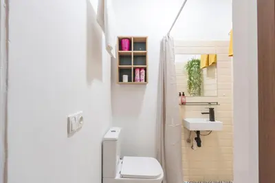 a small bathroom with a toilet and a sink at Apartment in Prague 1 next to Wenceslas Square in Prague