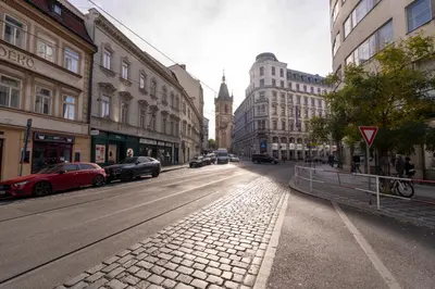 a city street with cars parked on the street at Apartment in Prague 1 next to Wenceslas Square in Prague