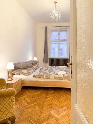 a bedroom with a bed and a window at Goldy River 3 BDR & 1 BTH Residence XXL 120m2 in Prague