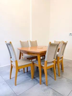 a wooden table with four chairs around it at Goldy River 3 BDR & 1 BTH Residence XXL 120m2 in Prague